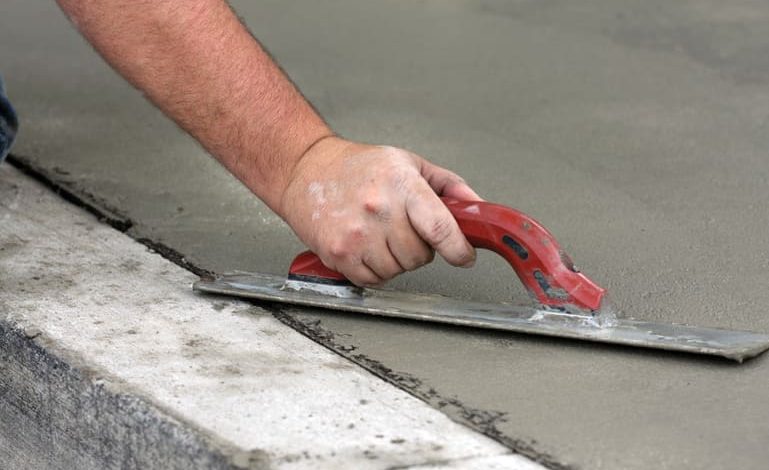 A men with pressing rapid concrete.